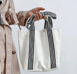 MKS AMERICA:  MINI STRIPE BOW HANDLE BAG